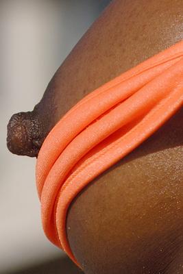 15P Ebony bodybuilder Victoria Dominguez exposes her boobs while modeling a bikini