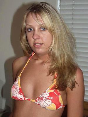 16P Blonde amateur Sierra doffs a bikini before parting her pink pussy on a bed