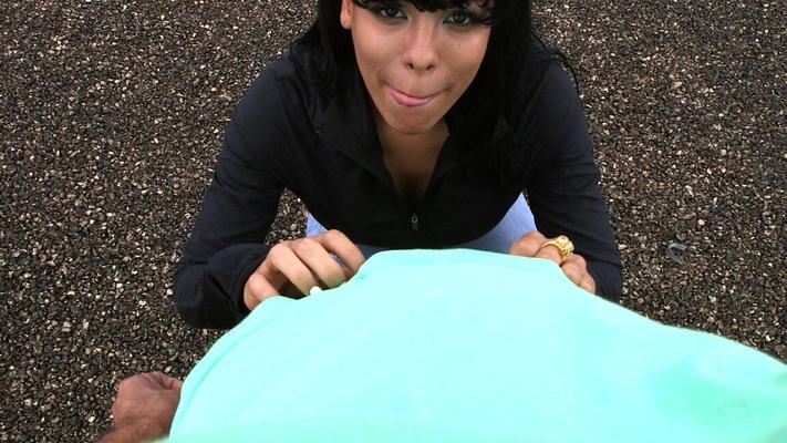 21P Latina with big fakes Luna Star kneels and gives a nasty blowjob outdoors