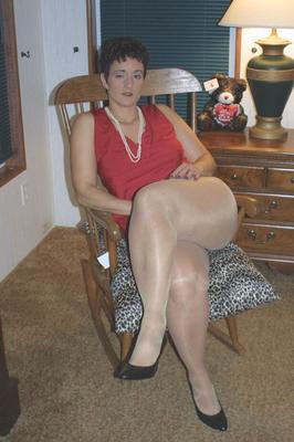 20P Short haired housewife Reba frees her pierced pussy from shiny pantyhose