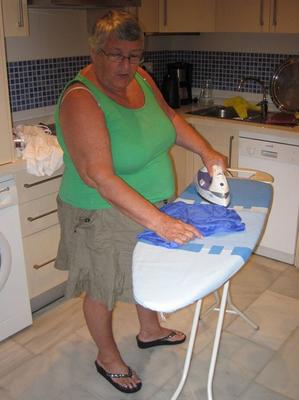 20P Overweight British oma Grandma Libby exposes her boobs while ironing