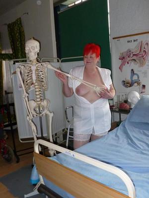 20P Redheaded nurse Valgasmic Exposed and a busty older lady play with a skeleton