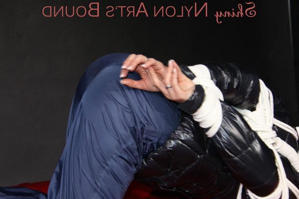 16P Sonja being tied, gagged and hooded on a shiny nylon bed with ropes and a