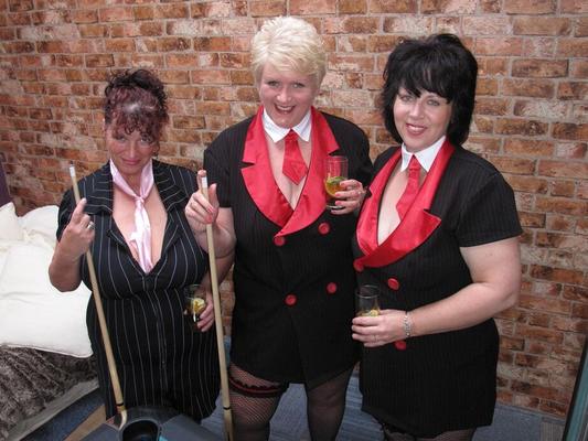 20P Busty older woman and two of her girlfriends blow a naked man on a pool table