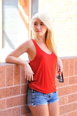 16P Sexy clothed girl in shorts and pigtails undressing and pissing outdoors
