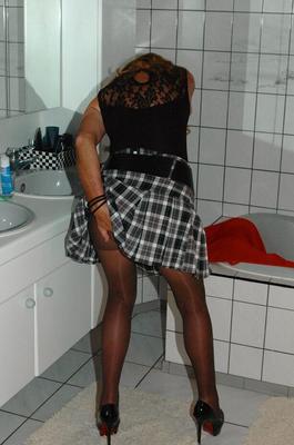 20P Mature redhead Kyras Nylons hikes her skirt over her pantyhose in the bathroom