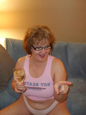20P Mature woman Busty Bliss bare her boobs before taking a cumshot on her stomach