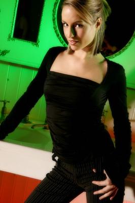 21P Hot babe Melanie shows her firm tiny tits as she teases in pantyhose