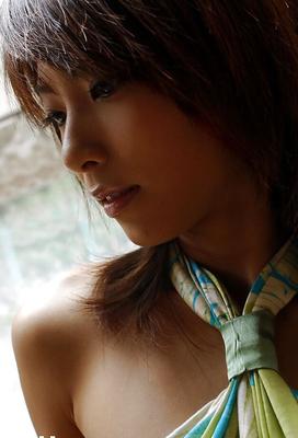15P Asian hottie Rin Suzuka uncovering her tits and taking off her panties