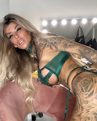 11P Blonde amateur Jacky Inked poses in green lacy lingerie in a sexy solo
