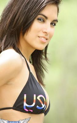 12P Pretty dark haired Rachel posing seductively outdoors wearing a black bikini