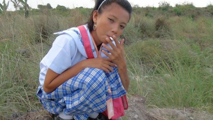 17P Smoking Filipina schoolgirl Sally opens her uniform to reveal sweet teen tits