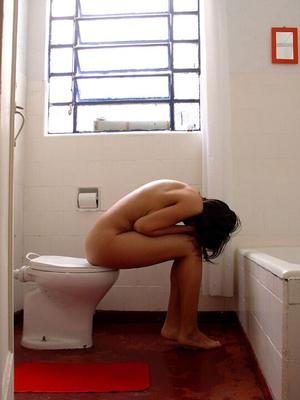 10P Pretty Indian girl is captured in the nude during candid action at home