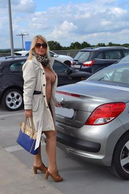 20P Kinky big tit mature exhibitionist wears nothing underneath coat in public