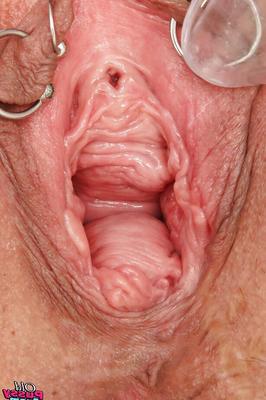 16P Raunchy granny toying her pierced cunt and pissing in gyno office