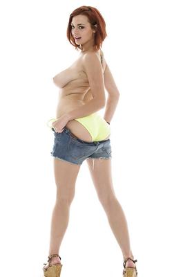16P Foxy redhead in daisy duck shorts uncovering her tempting curves