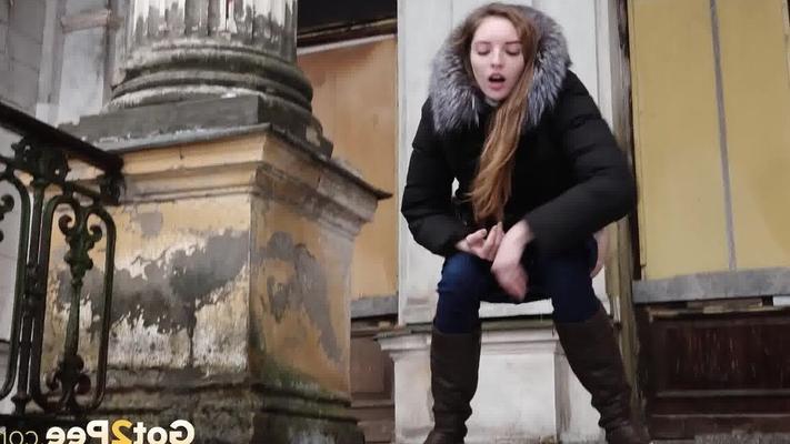 15P Clothed redhead Vika squats for a pee on the snow-covered steps of a church