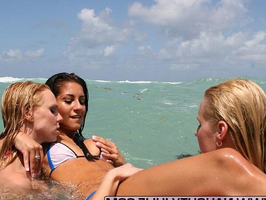 15P Blonde amateur Naughty Julie shares lesbian kisses while in the ocean