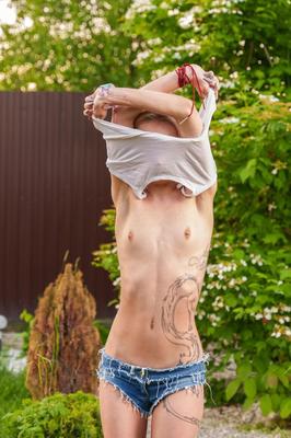 21P Slender European teen Tea Mint flaunts her tiny tits and masturbates outdoors