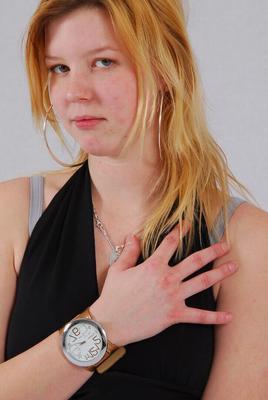 16P Kylie wearing her own Geneva huge cuff watch