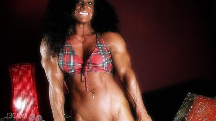 21P Brunette American bodybuilder Debbie Bramwell flaunts her hot abs and muscles