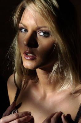 12P Beautiful blonde Sandra Sanchez looses a boob from lingerie near a garden wall