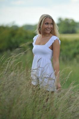 12P Blonde girl Michaela shows her bare ass after getting naked in a field