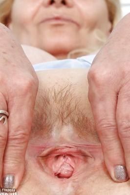 16P Filthy granny in nurse uniform masturbating her twat with toys