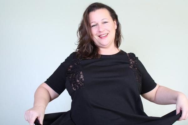 16P Fat British woman hold her boobs while standing in stockings and heels