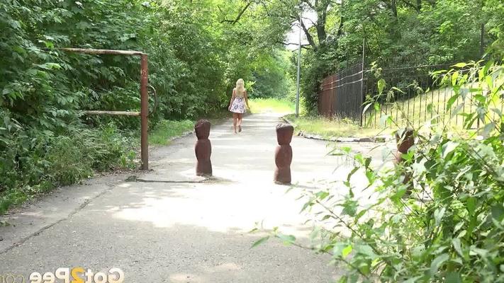 15P Blonde girl Victoria Pure squats for a piss on a footpath in a park