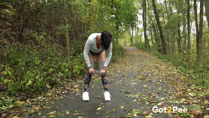 15P Female jogger Gabriellla Gucci pulls down her leggings for a pee in the woods