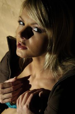 16P Beautiful blonde Sandra Sanchez casually frees her small tits from a bra