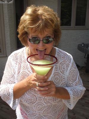 16P Older amateur Busty Bliss exposes her big natural tits over a cocktail