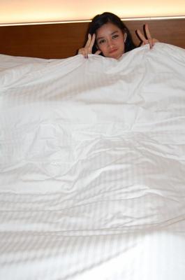 19P Amateur Asian girl Alexis reveals her petite figure and poses on a bed