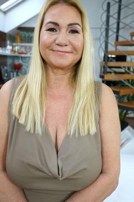 17P Mature blonde Pam Pink stripping her dress and flaunting her huge natural tits