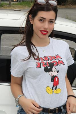 12P Hot girl displays her sexy feet in a car while wearing a Mickey Mouse T-shirt