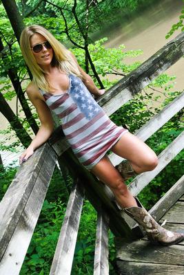 15P Amateur blonde slut Madden posing outdoors in short skirt & thong with boots
