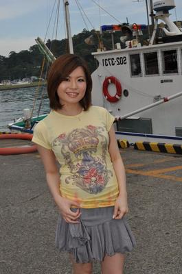 15P Young Japanese girl Miki Uemura poses on non nude in a skirt on a dock