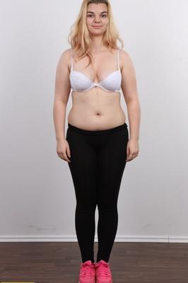 12P Chunky blonde girl Aneta stands fully clothed and then as naked as one can get
