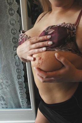 21P Voluptuous blonde Zdenka K undresses and shows off her natural knockers & ass