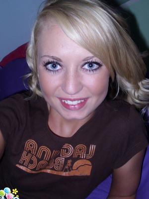 12P Cute blonde Codie Sweets takes selfies while getting butt naked on her bed