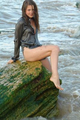 16P Nice teen girl Petra E removes her shirt after wading out into the ocean