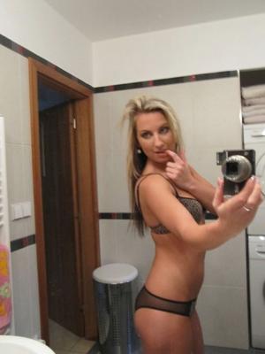21P Naked blonde Lexxis P. flaunting her small tits in the laundry room