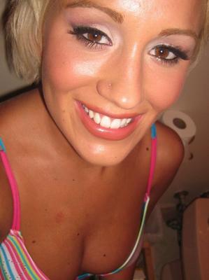 16P Short haired blonde Tristan Taylor undresses on bed to appease her boyfriend
