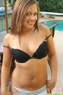 12P Cutie Lili Jensen strips her sexy shirt and bra off by the pool
