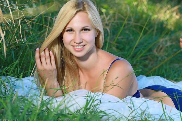 12P Tiny titted blonde removes her bra and panties to spread naked outdoors