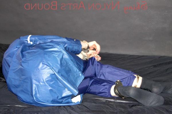 16P Lucy tied with cuffs overhead and gagged with a clothgag wearing sexy blue