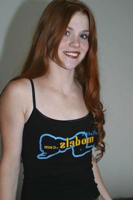 16P Fair skinned redhead Tiffany exposes her perky breasts in solo action