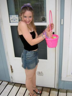 12P Charming young girl exposes a nipple while collecting Easter eggs