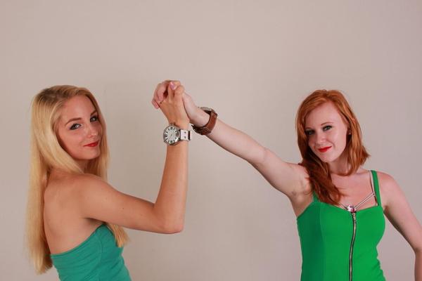 16P Lesbian girls Eva and Amanda display their Oozoo watches while fully clothed